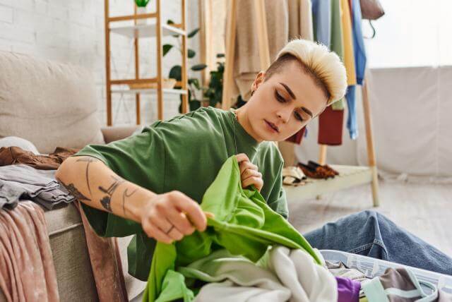 young stylish and tattooed woman holding green ga 2023 11 27 04 48 59 utc scaledmn